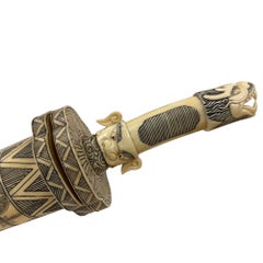 Vintage Chinese decorative hand-carved Asian short sword and scabbard