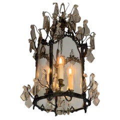 Louis XV-style lantern in blackened brass decorated with cut crystal pendants, a