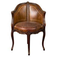 Louis XV style office armchair in carved wood, brown leather, circa 1920