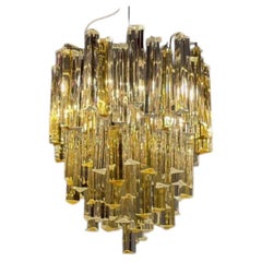 Venetian chandelier made of colorless and gold Murano glass, Venini Triedi model