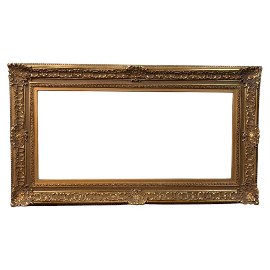 Wooden frame with stucco and gold from around 1900 For Sale