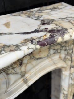 Louis XV style fireplace in violet breccia marble, around 1880