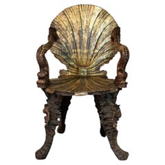 Poltrona veneziana “Grotto” in legno intagliato policromo, argentato e dorato, 1890