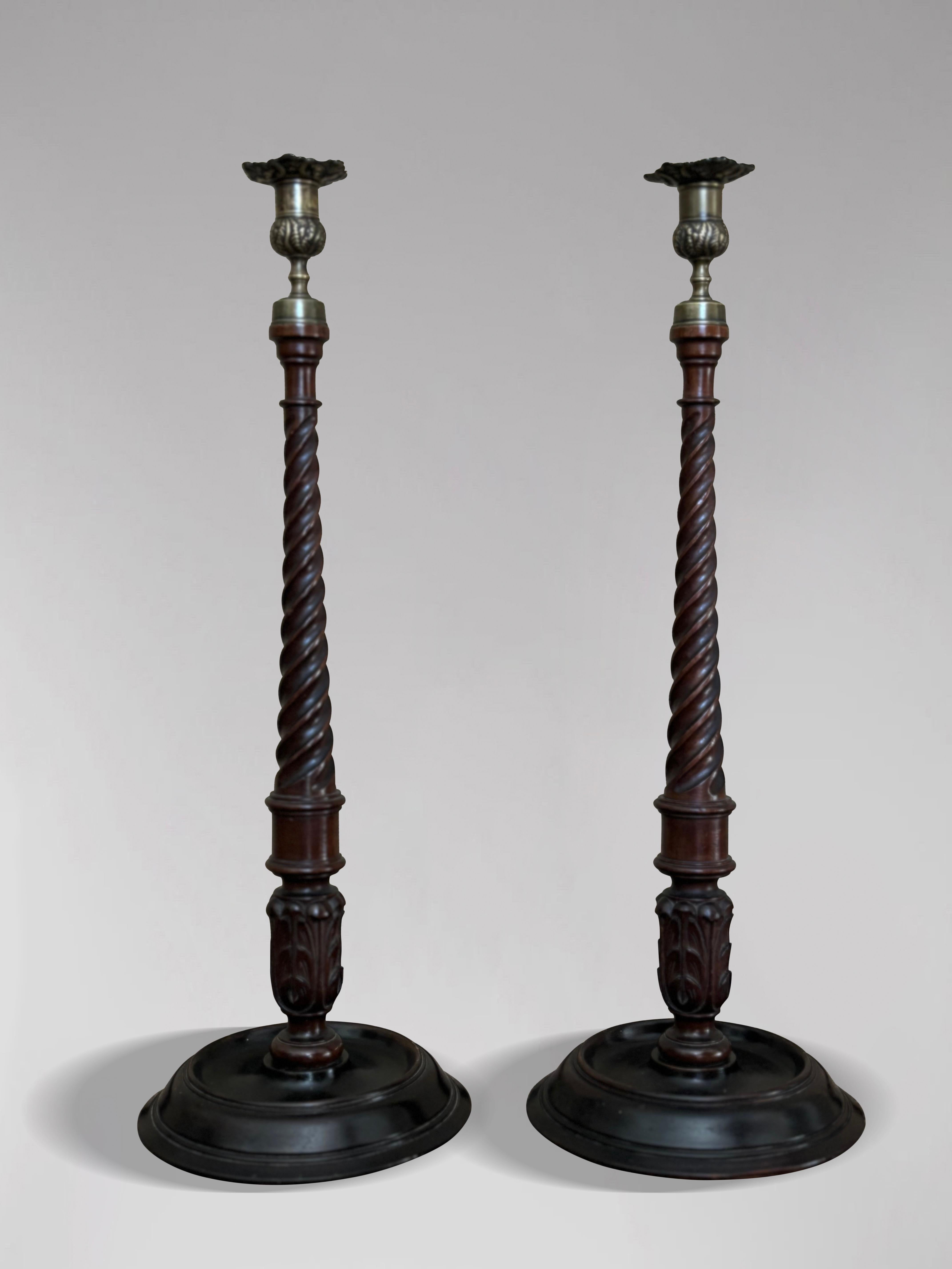 A Tall Pair of Fine Quality 19th-Century Scottish Mahogany and Brass Candlesticks (Circa 1830)

This exquisite pair of tall 19th-century Scottish mahogany and brass candlesticks showcases exceptional craftsmanship in the 18th-century Georgian style.