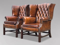 Pair of Late 19th Century Brown Leather Chesterfield Wing Back Armchairs