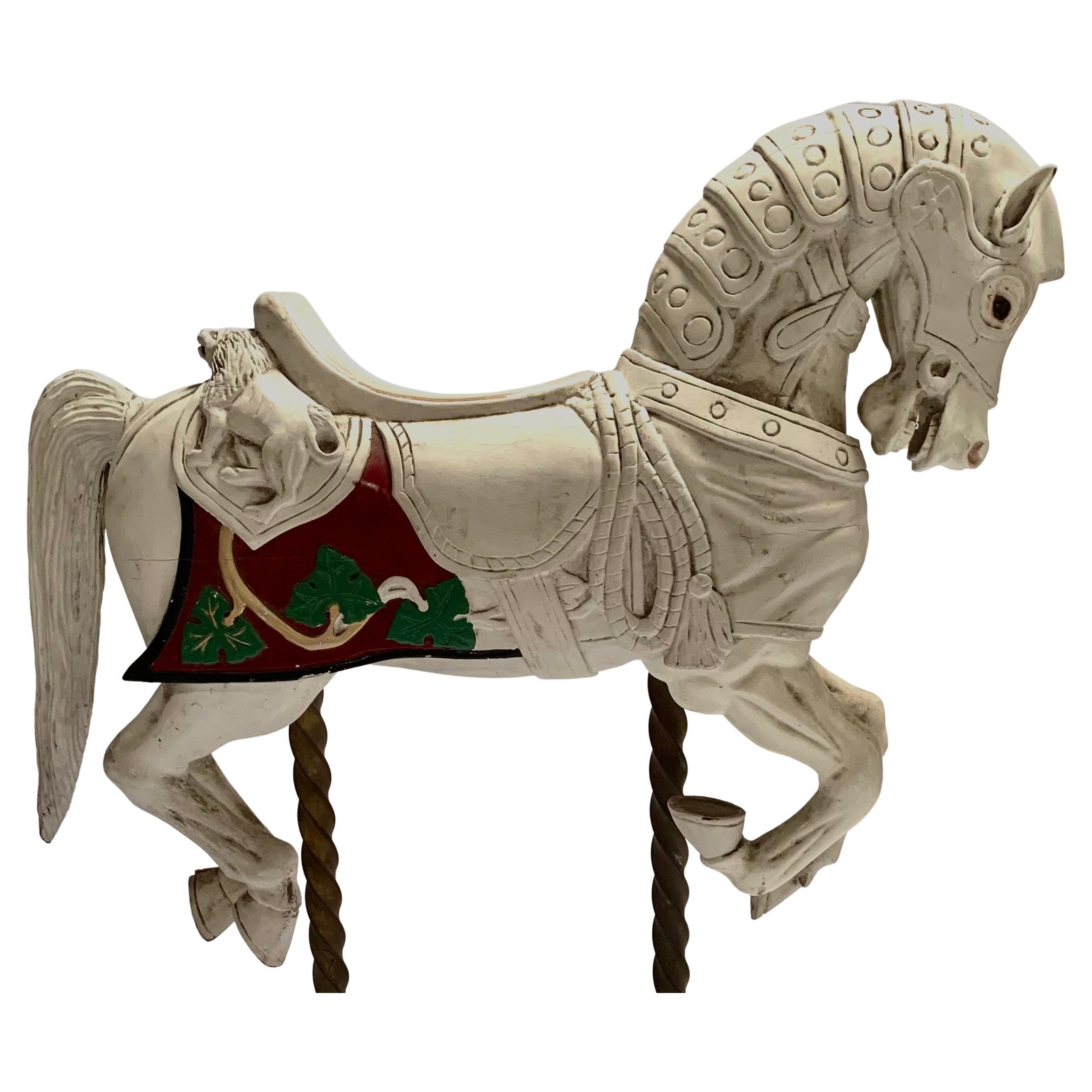 Juvenile carved wooden carousel horse carved in the style of Charles Loof.
Lions carved into the back of the saddle.
Requires little restoration.
Started to paint 40 years ago but never found the time to finish. (See photo)
Part of a private