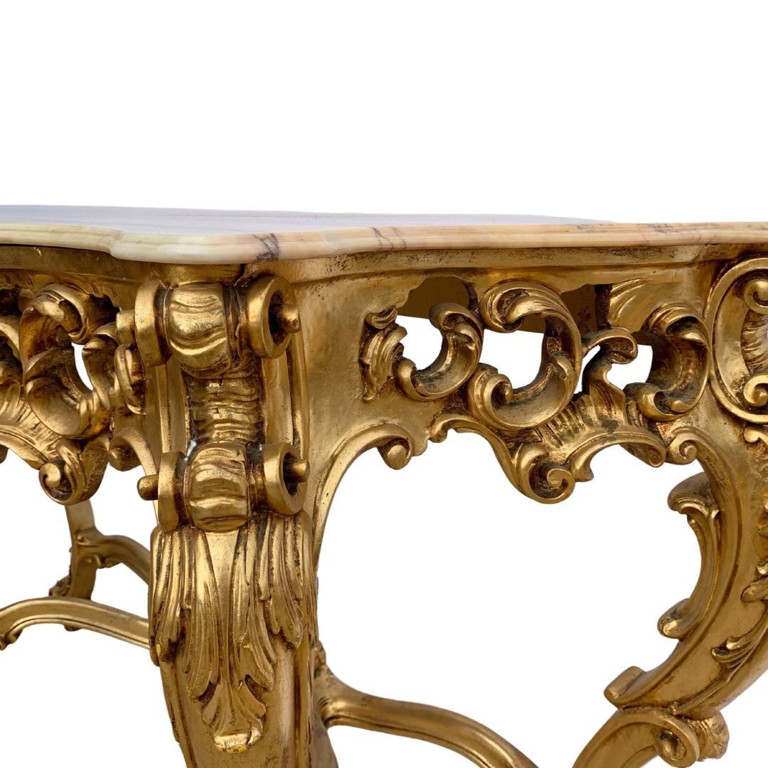 Heavily carved Vintage Louis XIV style Giltwood Console table.
 This very attractive piece came from a European Consulate where it was in daily use for 30 years.
