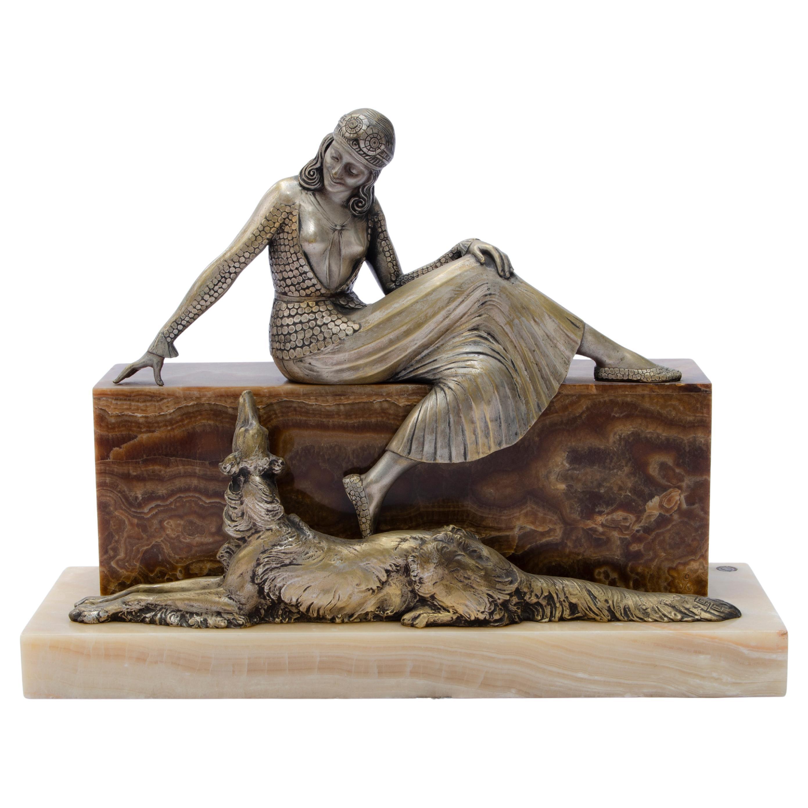 Sculpture “Woman seated with greyhound” by Armand Lémo