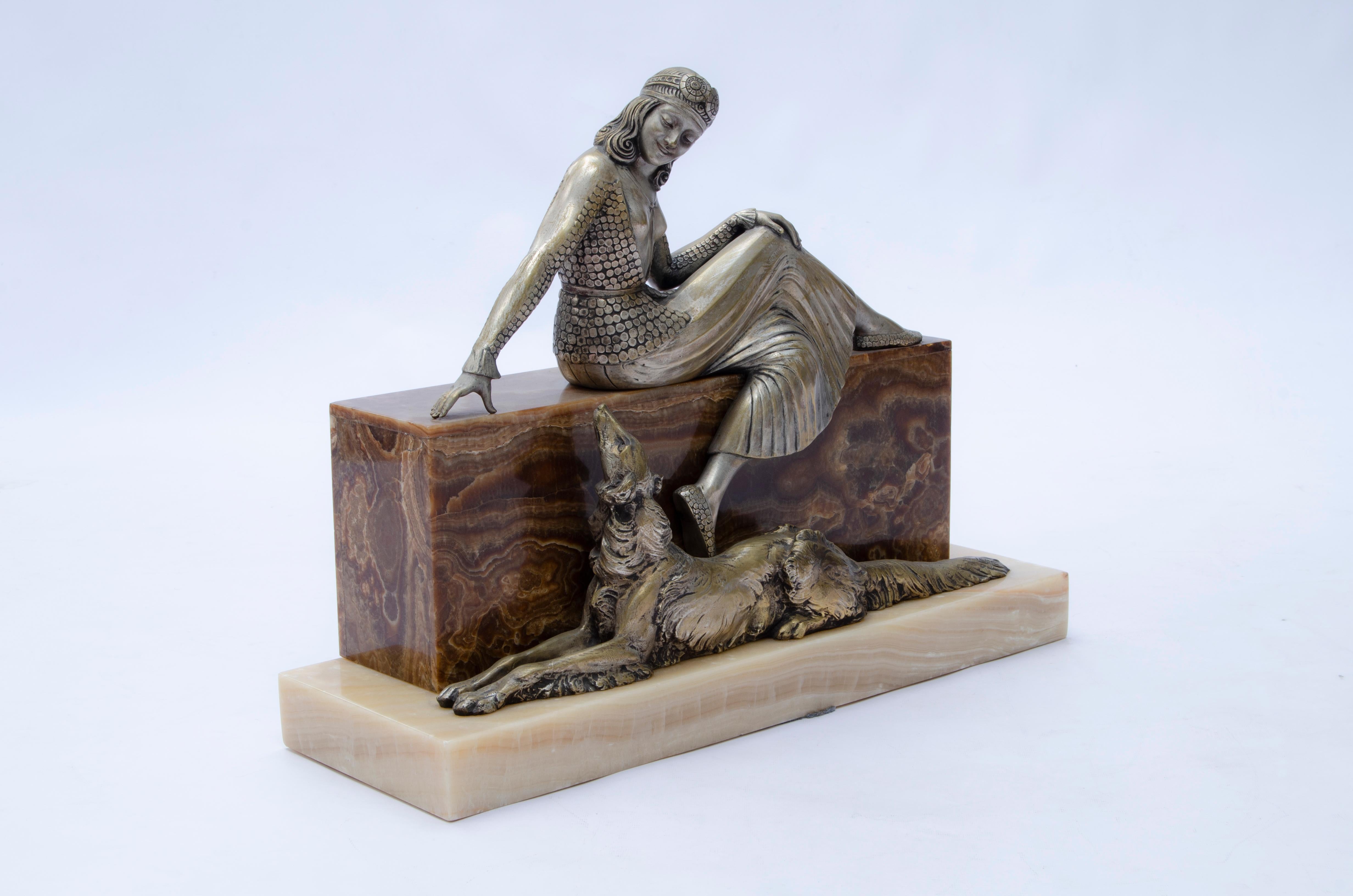 Sculpture called “Woman seated with greyhound” by Armand Lémo (1881-1936), made of silver-plated bronze and onyx marble base.

LEMO signature with foundry coin Casa Vignes DE M.v. Sanchez, Florida 361 Buenos Aires.

The pieces that have this coin