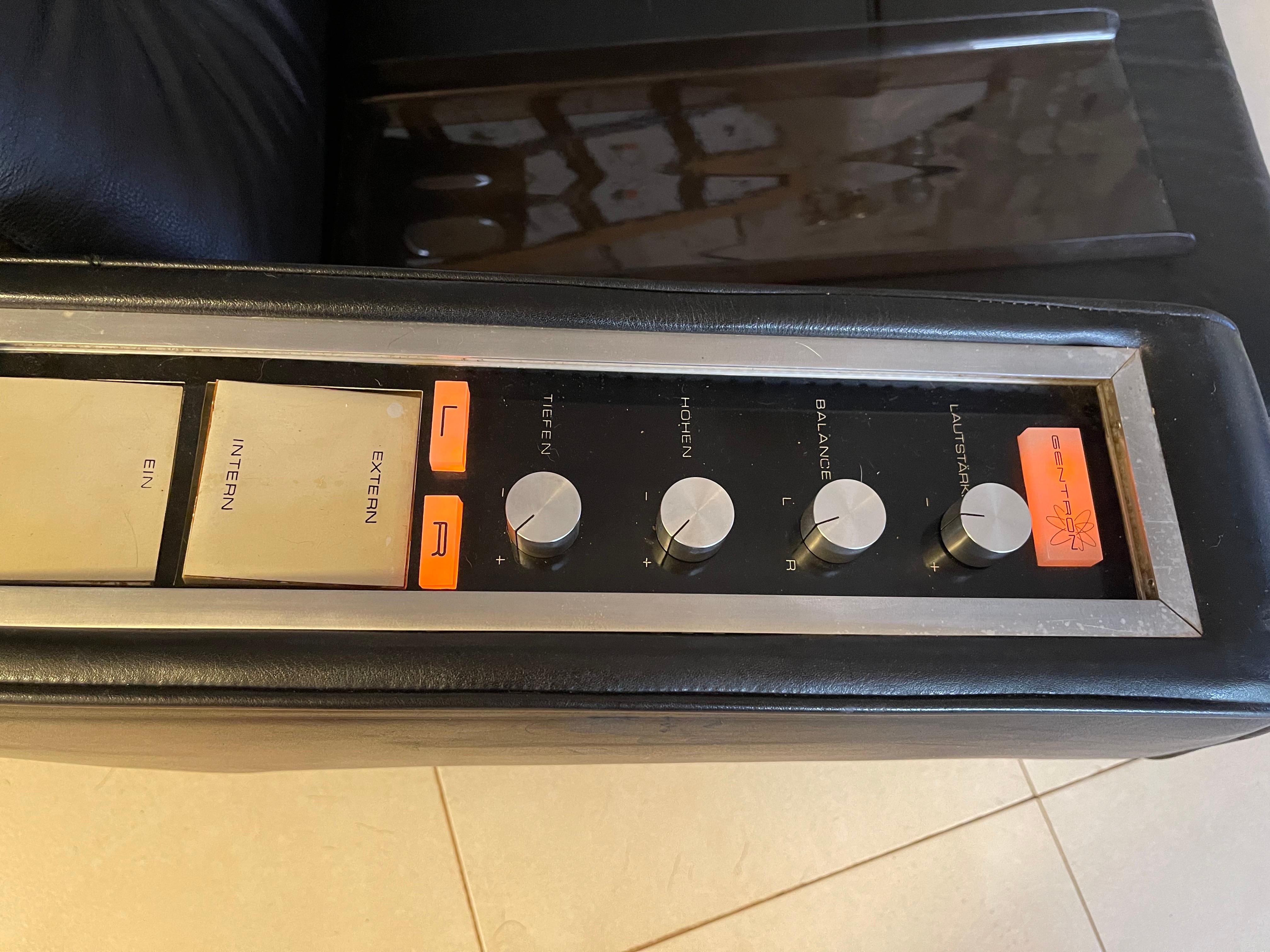 A unique pair of original black leather armchairs with a unique WORKING audio amplifier and management system! made to be used in a film!, designed by Robin Day for Hille, this is the 