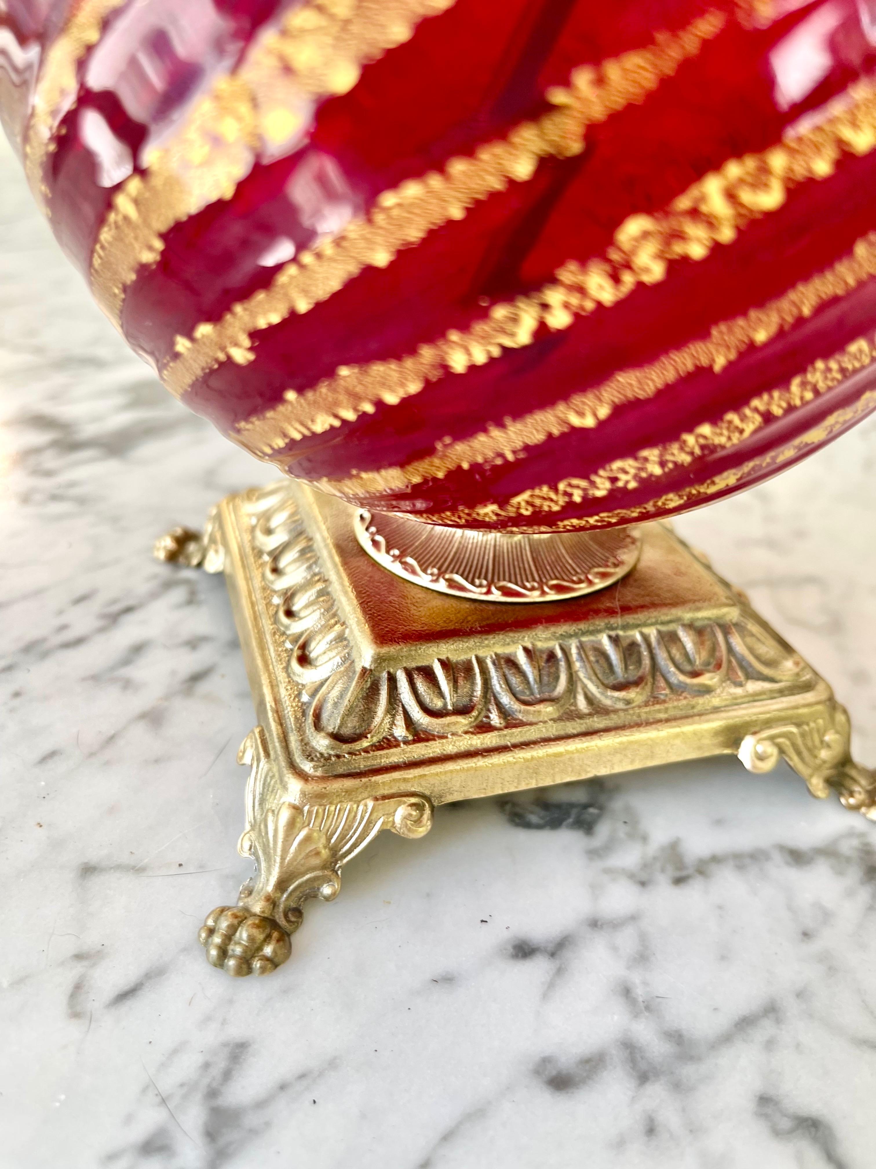 Elegant Murano Ruby Red Table Lamps Murano Rigadin circa 1960, Italy. Red and gold Murano glass, Reconnected brass. Dimensions: 33 cm high, 13 cm diameter: 33 cm high, 13 cm diameter.
