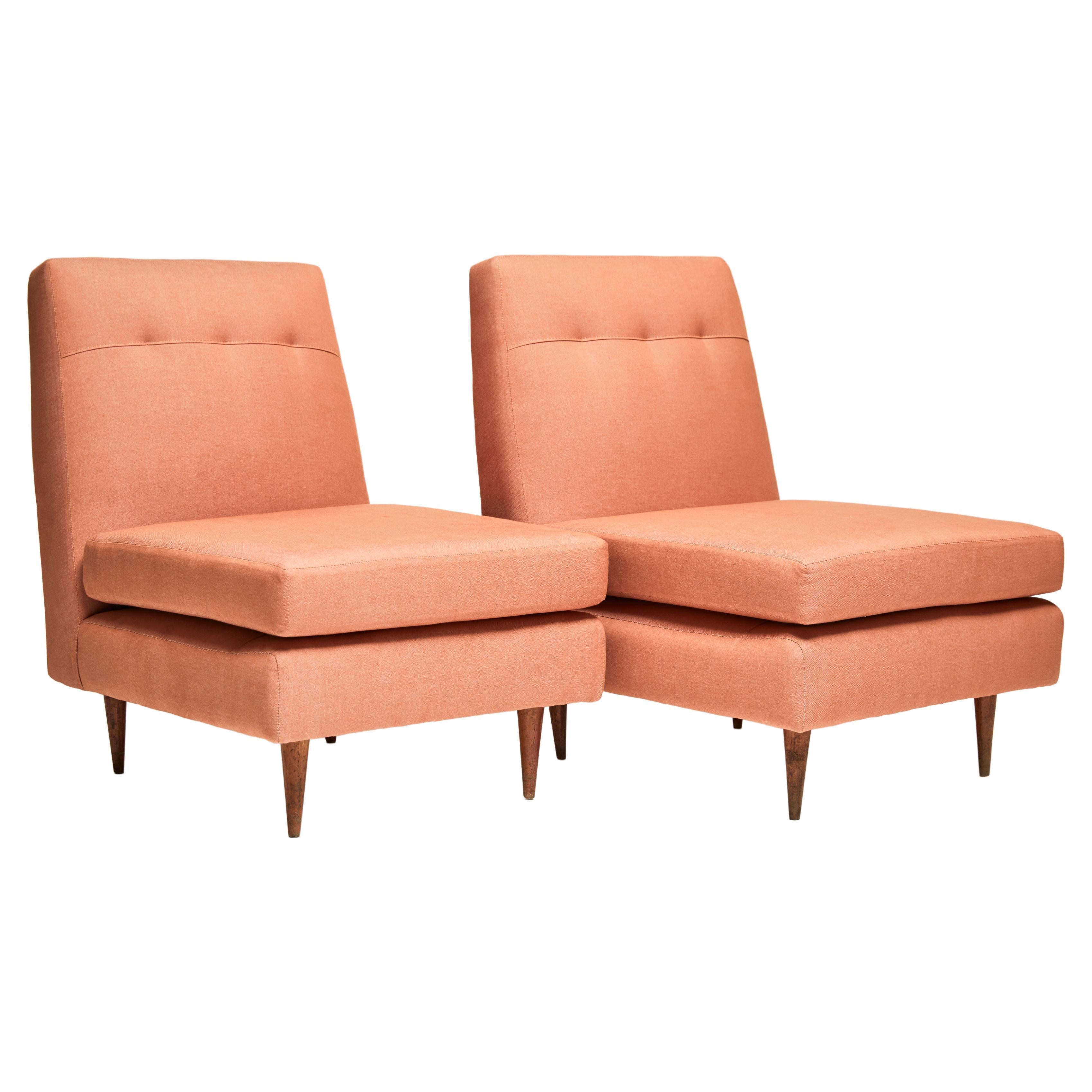 Available now, this Mid-Century Modern armchairs in hardwood & salmon linen by Joaquim Tenreiro are gorgeous!

These elegant low armchairs consist of a hardwood structure with re-upholstered loose cushions in orange linen. Besides the small marks of