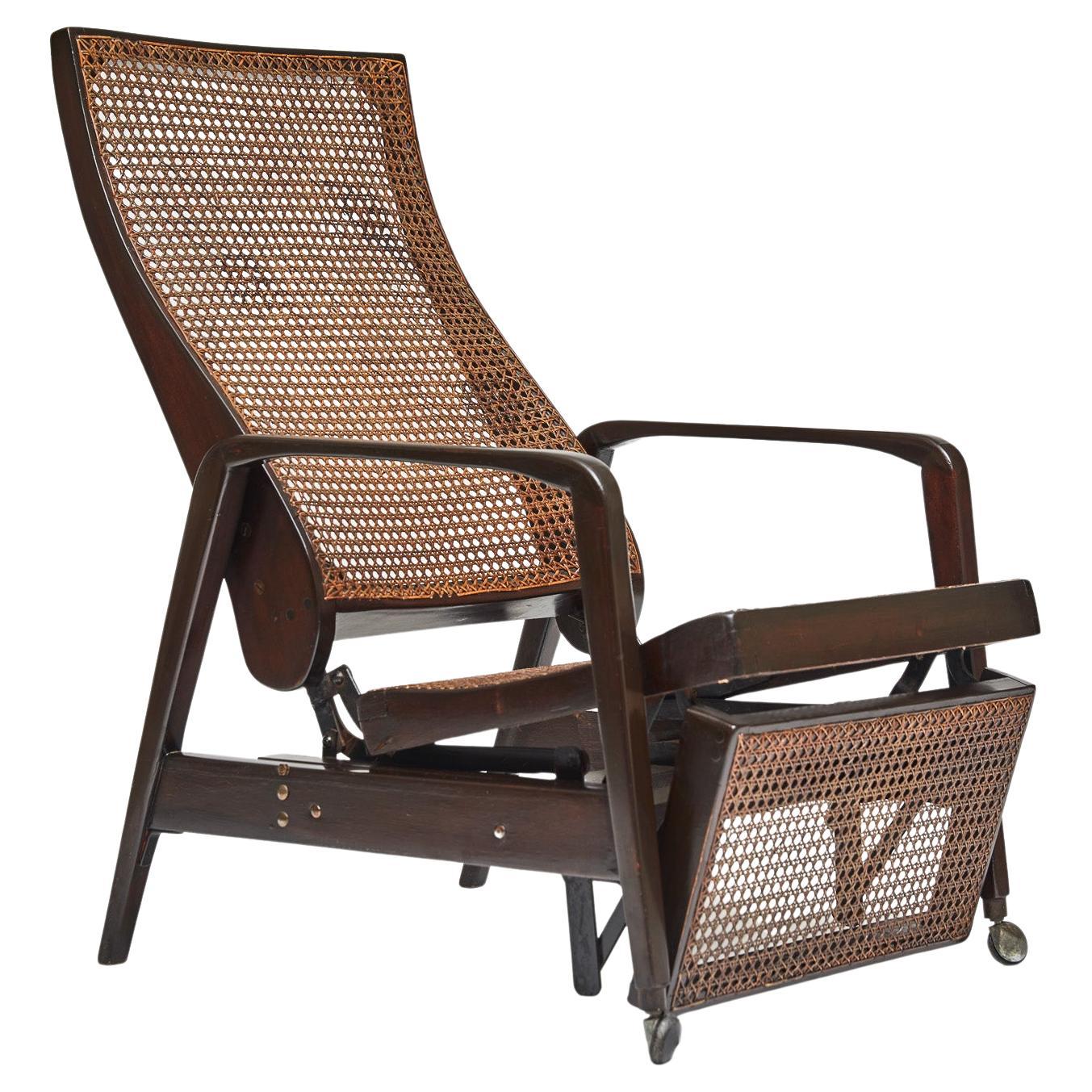 Available today, this Mid-Century Modern sun deck chaise in hardwood & cane designed by Walter Gerdau in 1942 is gorgeous! 

This beautiful sun deck chaise has a darkened wood structure with original Indiana cane on the seat/back and is very