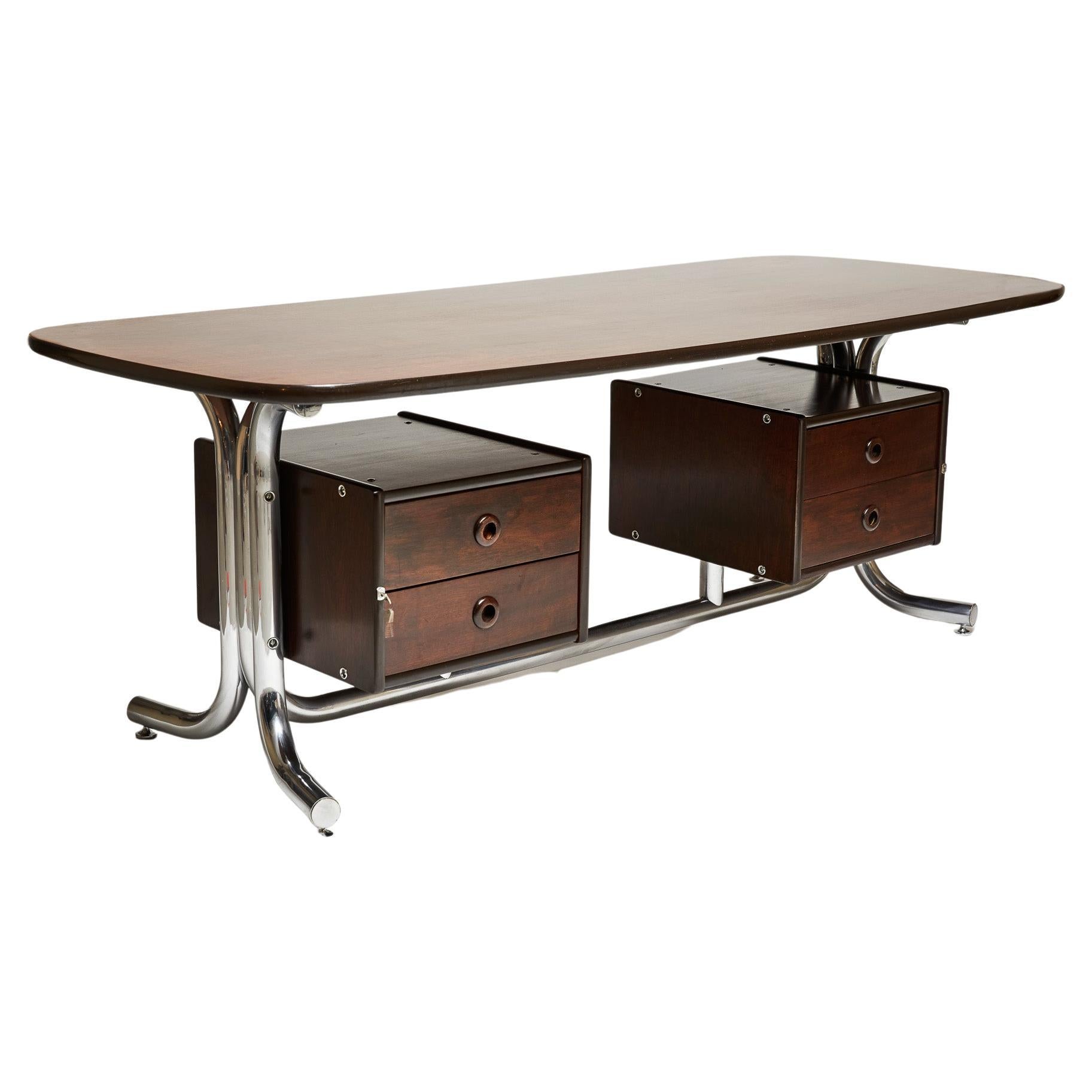This Brazilian Modern desk has a chromed tubular metal base with top and drawers in agglomerated wood and Jacaranda (Brazilian rosewood) leaf. It has 4 floating drawers; keys are available. The wood has been refinished, the metal cleaned up and the