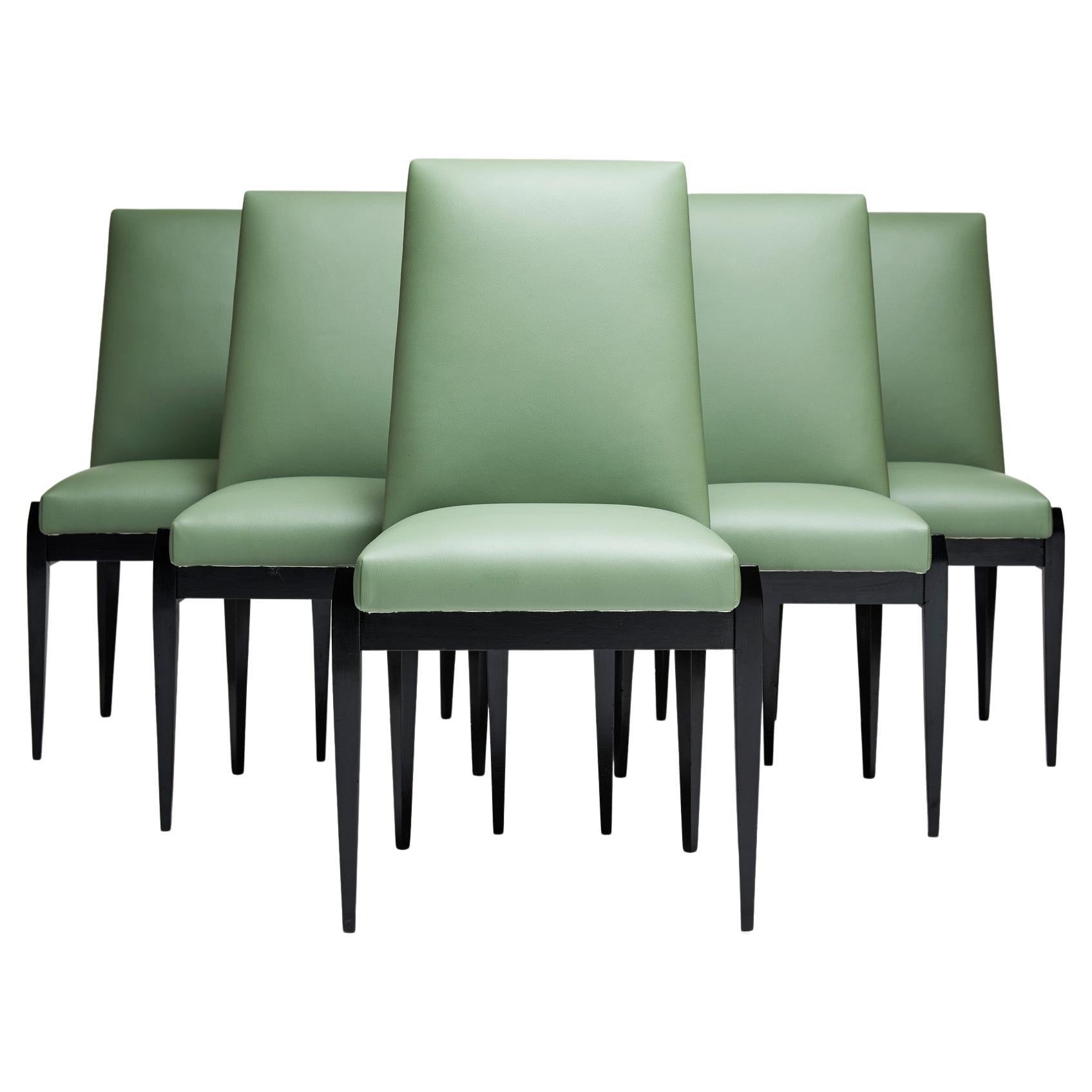 Available today, this candy like, Brazilian Modern set of six dining chairs in hardwood & green leather by Cimo, are breathtaking.

The set consists of 6 dining chairs in ebonized hardwood frame and leather seats. The wood has been refinished and
