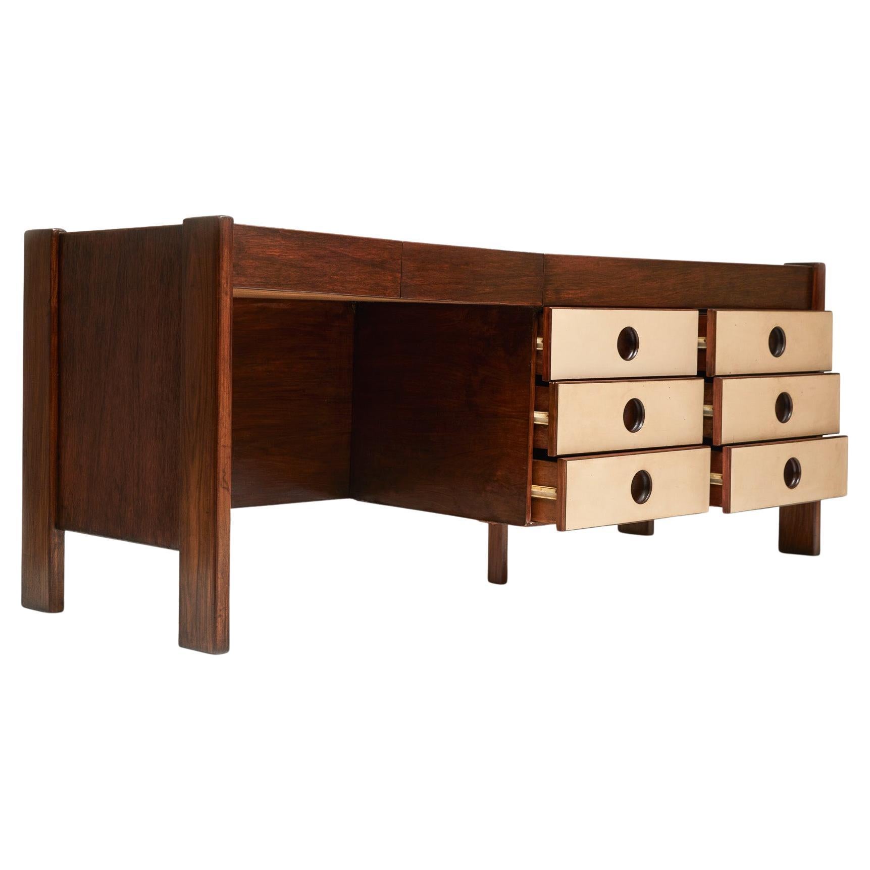 Available today, this Brazilian Modern desk in Light hardwood designed by Jorge Zalszupin for L’Atelier, is gorgeous!

The desk is made of Caviuna hardwood and Formica finishes. It has 6 floating drawers and 2 more in the left side. The top of the