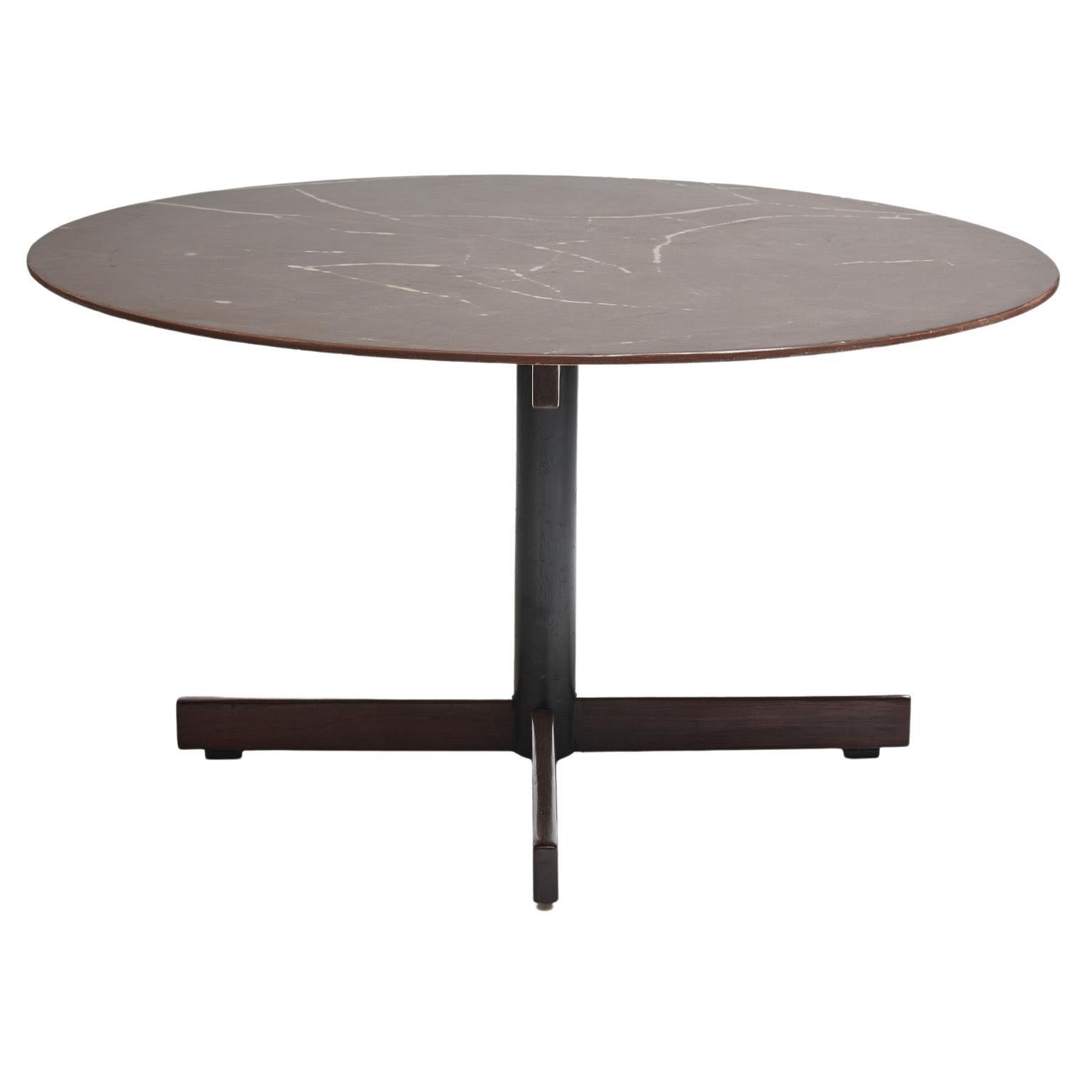 Available today, this midcentury modern Round Dining Table in Hardwood & Granite designed by Jorge Zalszupin, in the sixties is exquisite.

The table consists of a granite top and “X” shape base made of steel and Brazilian Rosewood, as known as