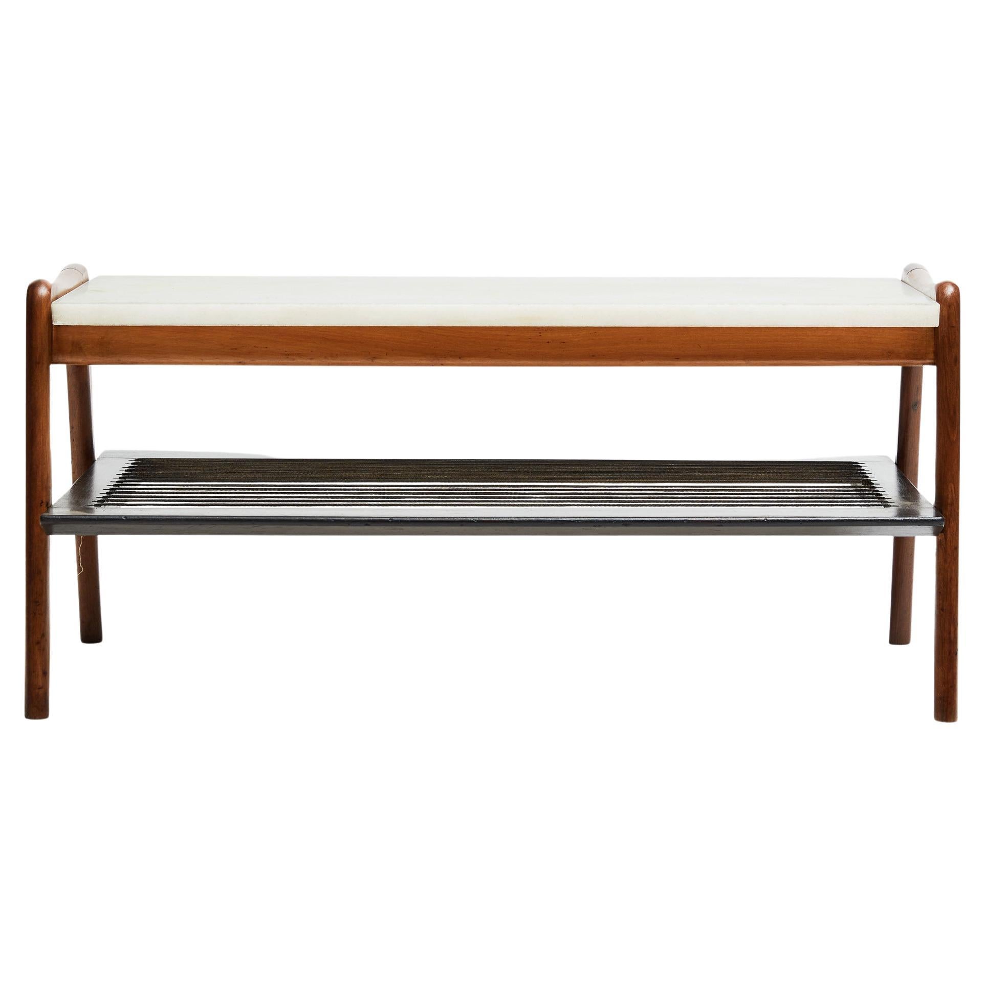 Available today, this Mid-Century Modern Coffee Table designed by Moveis Bergamo in the fifties is gorgeous! 

This rare and elegant coffee table is made of two types of hardwood: Pau Marfim (ebony) and light brown Caviuna. The lower stage consists