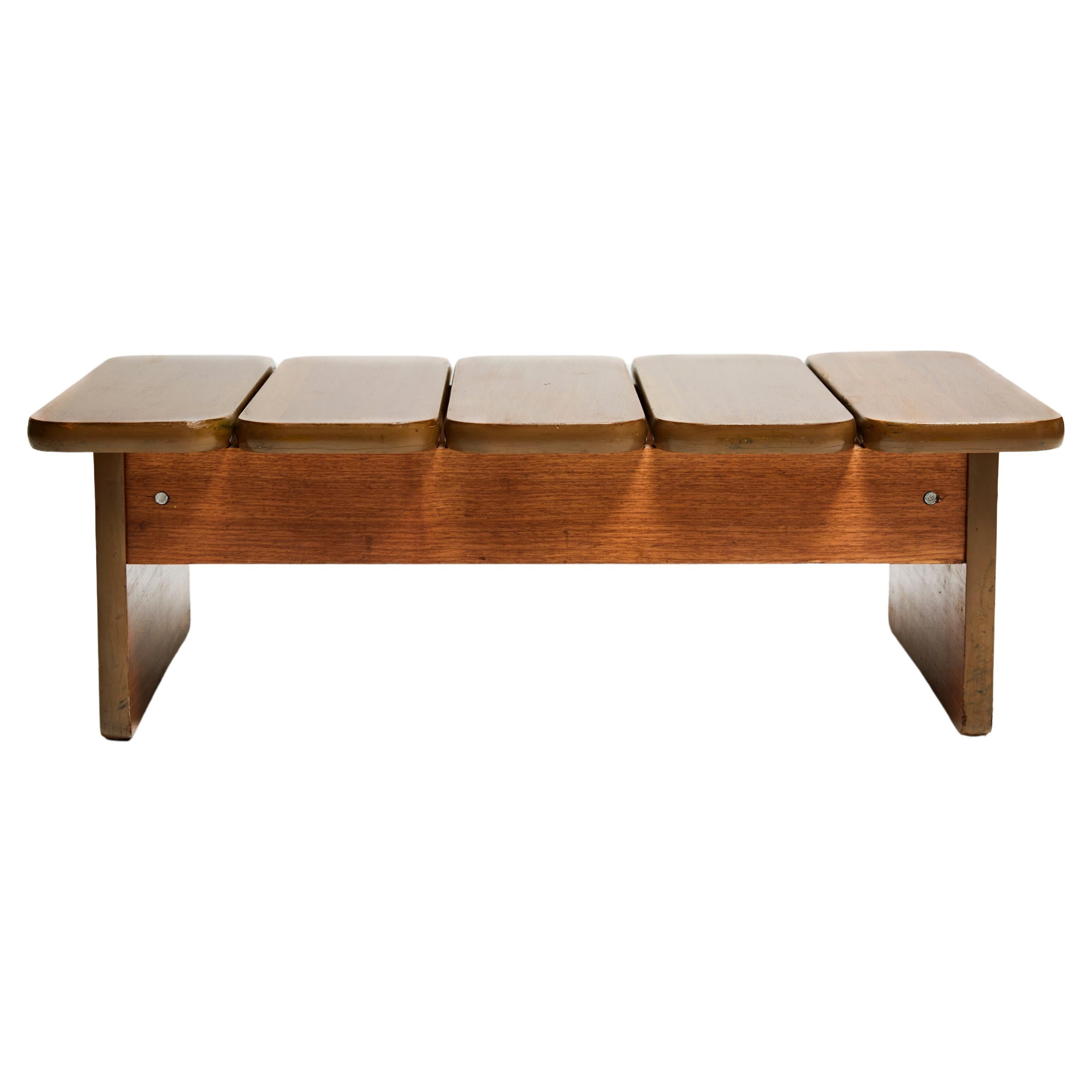 Available now, this Brazilian Modern Bench in Hardwood designed by Geraldo de Barros for Hobjeto in the seventies is nothing less than gorgeous!

This Mid-century modern bench is made of hardwood and consists of a low base structure five wood slabs