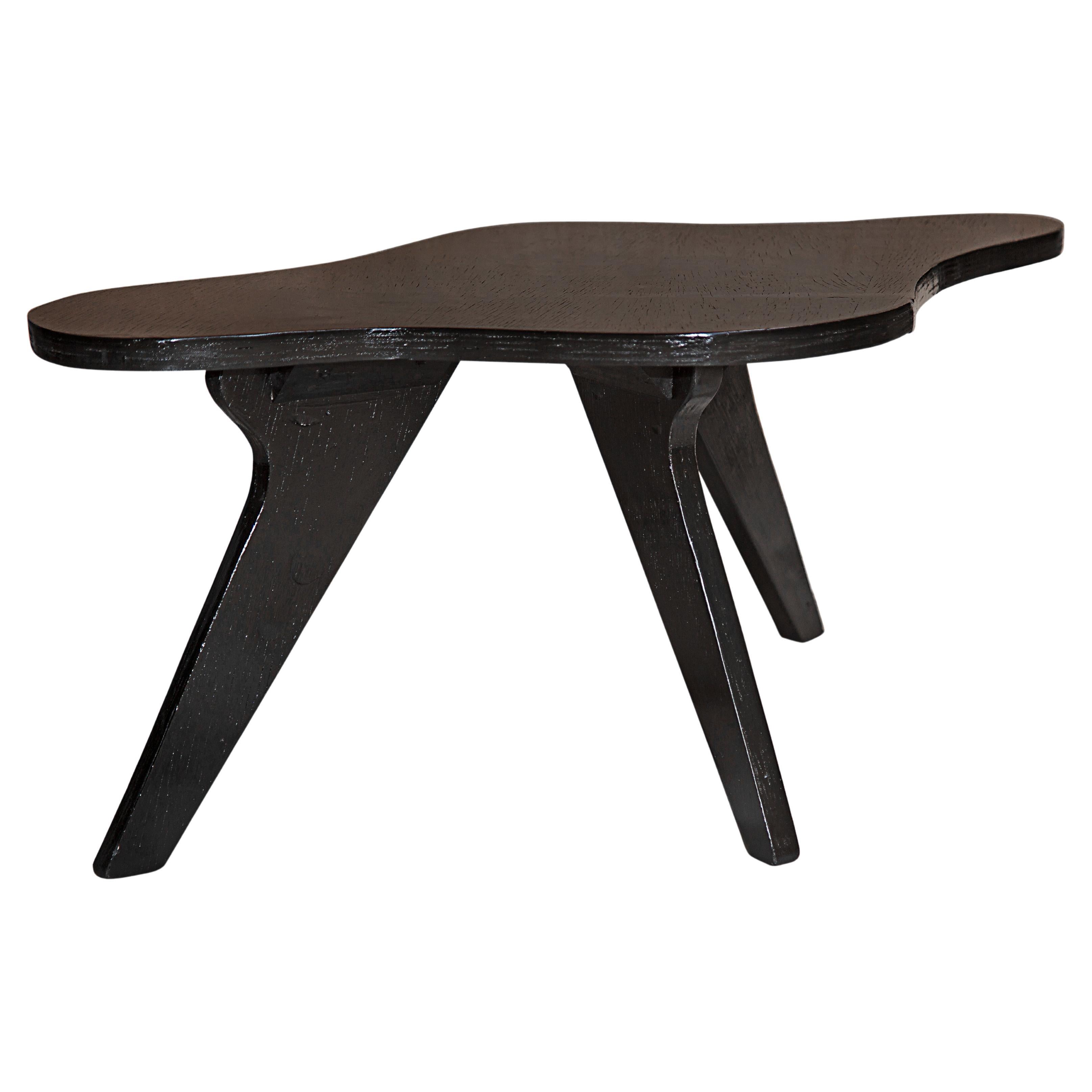 Available today, this iconic Mid-Century Modern Coffee Table made of wood in Black designed by Jose Zanine Caldas, in the fifties is a gorgeous piece!

The iconic coffee table has an organic shape and is made of plywood with three legs. Zanine’s