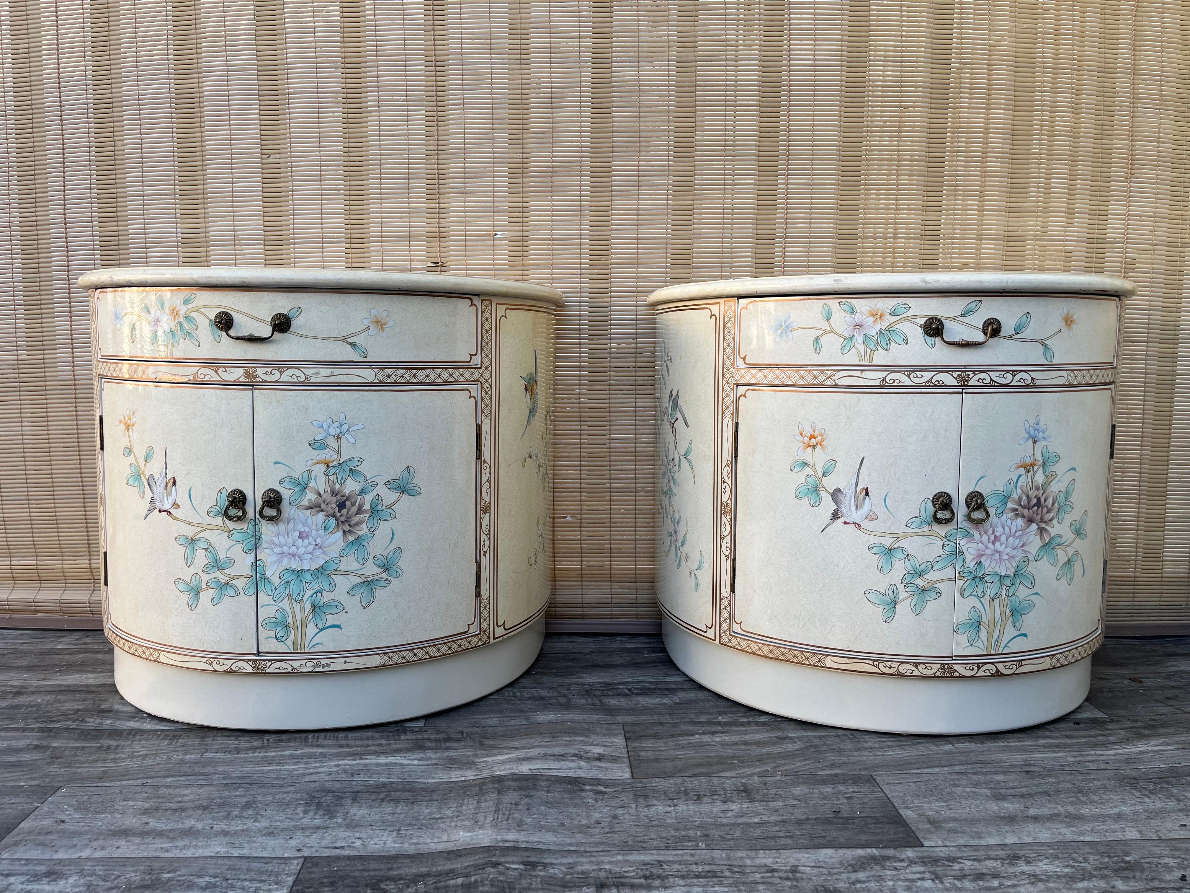 A pair of late 20th century Chinoiserie Lacquer nightstands Circa 1990s.
Feature rounded fronts with an ornate light yellow lacquer finish with an intricate chinoiserie decoration and removable glass tops. Offering plenty of storage room with top
