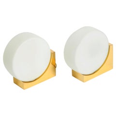 Pair of 60s wall lamps made of brass and round glass shades by Kaiser Leuchten