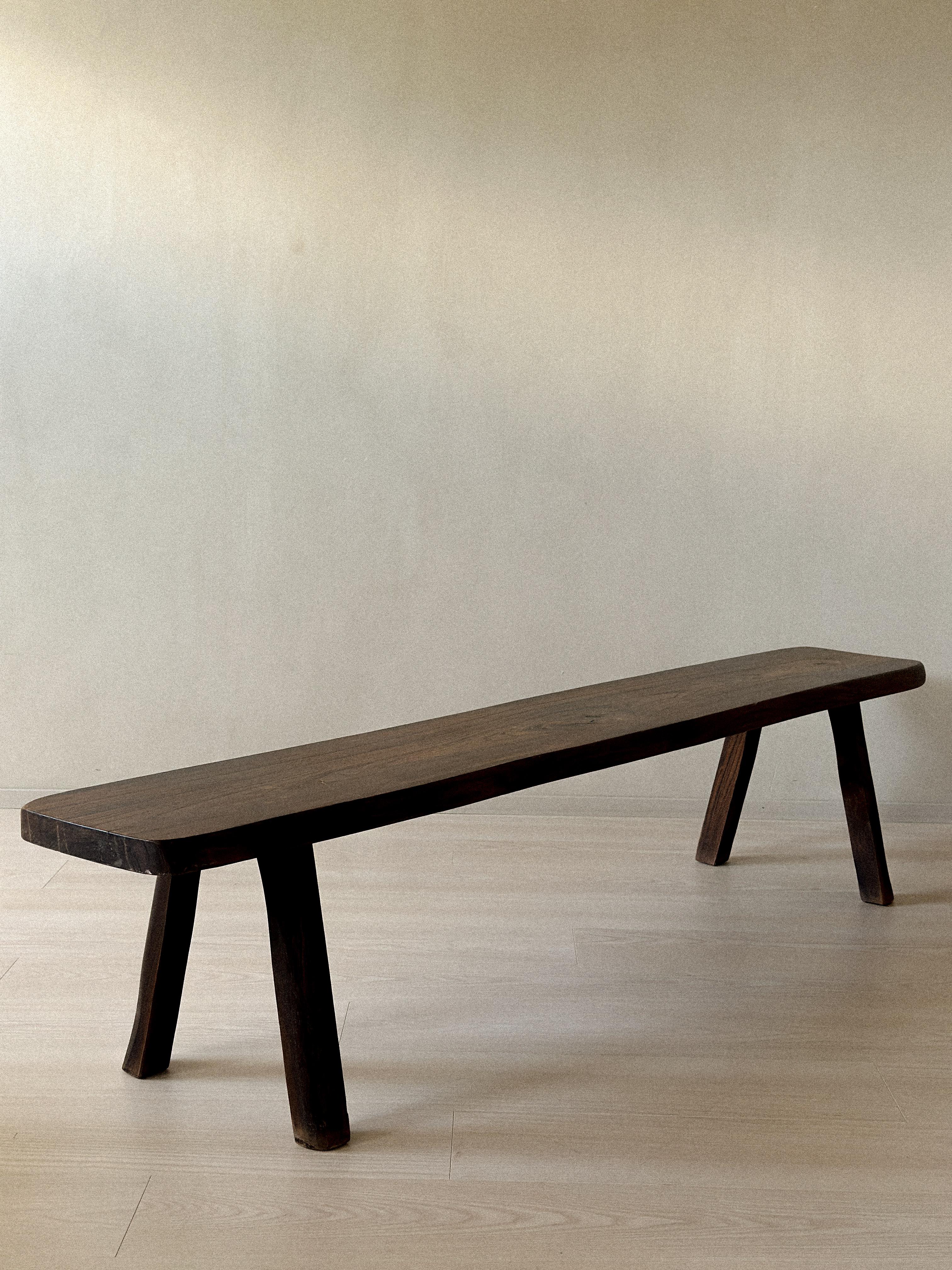 A wonderful brutalist bench manufactured by Aranjou, France c. 1960s. Massive dark stained oak and organic shape. 

Wear consistent of age and use. Marks, scratches. 

