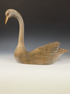 Pair of Large Weathered Hand-Carved Wooden Swans with Brass Beaks