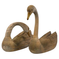 Pair of Large Weathered Hand-Carved Wooden Swans with Brass Beaks