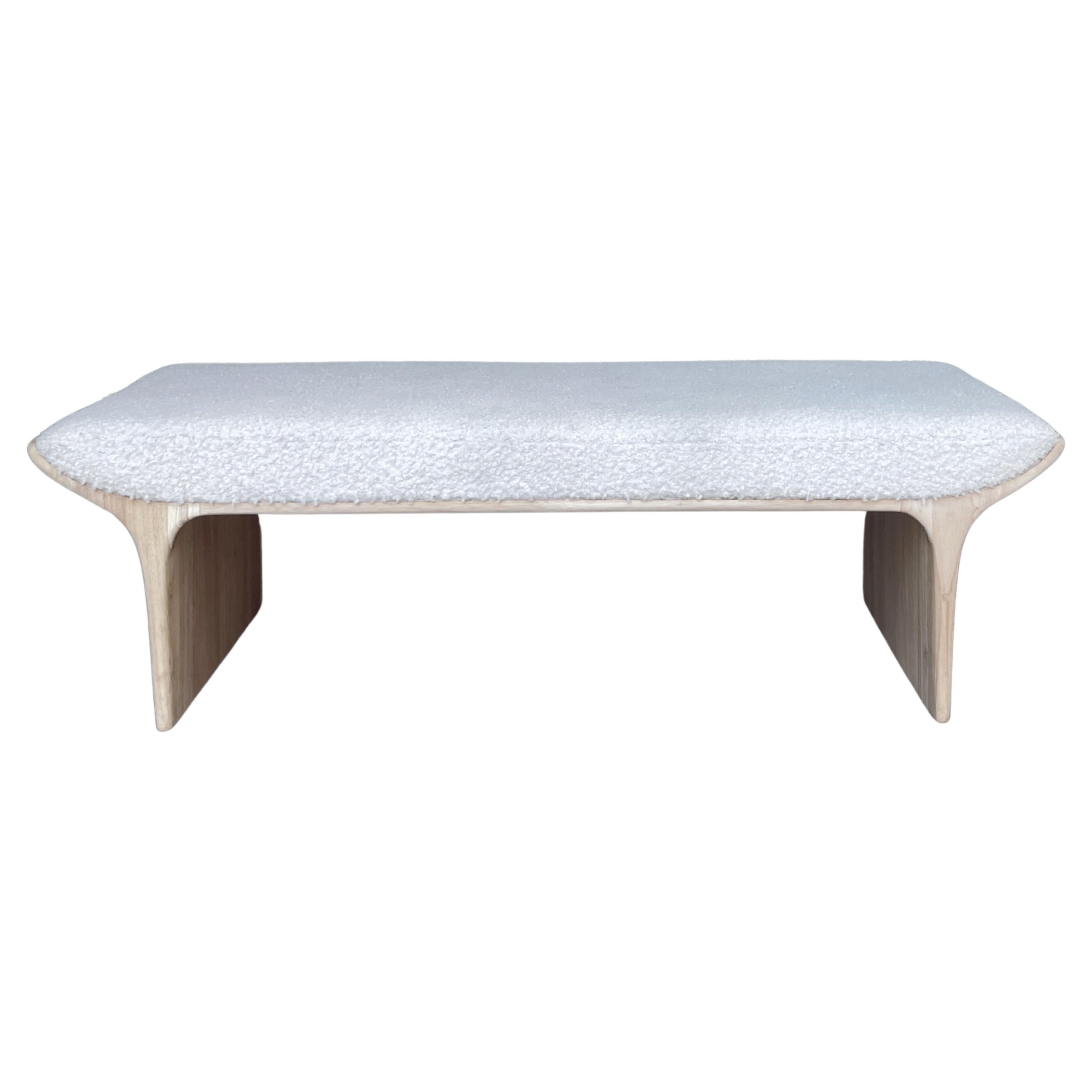 Sculptural waterfall bench, crafted from solid hardwood, with Boucle upholstery.
A timeless minimalist design, organic curves which are accentuated by the luster of a tradition Scandinavian natural soap finish. The generously deep seat makes this