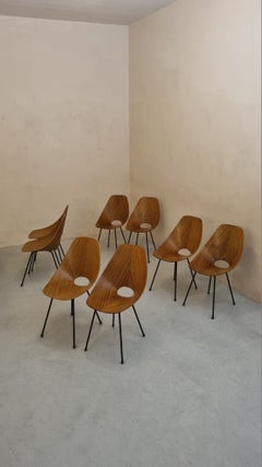 Medea dining chairs by Nobili for Tagliabue, Italy, 1956, plywood and brass.