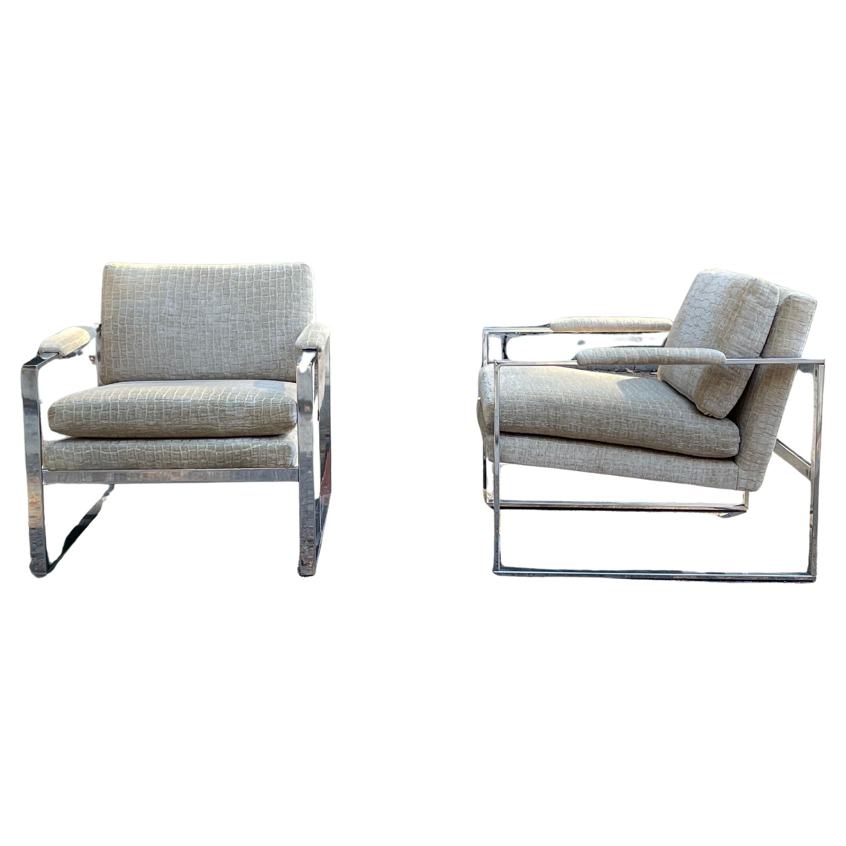A stunning pair of vintage mid-century chrome lounge chairs attributed to Milo Baughman. High end upholstery perfectly complements the chrome.

Upholstery is in excellent condition. Chrome is also in very good condition with minor flaws as expected