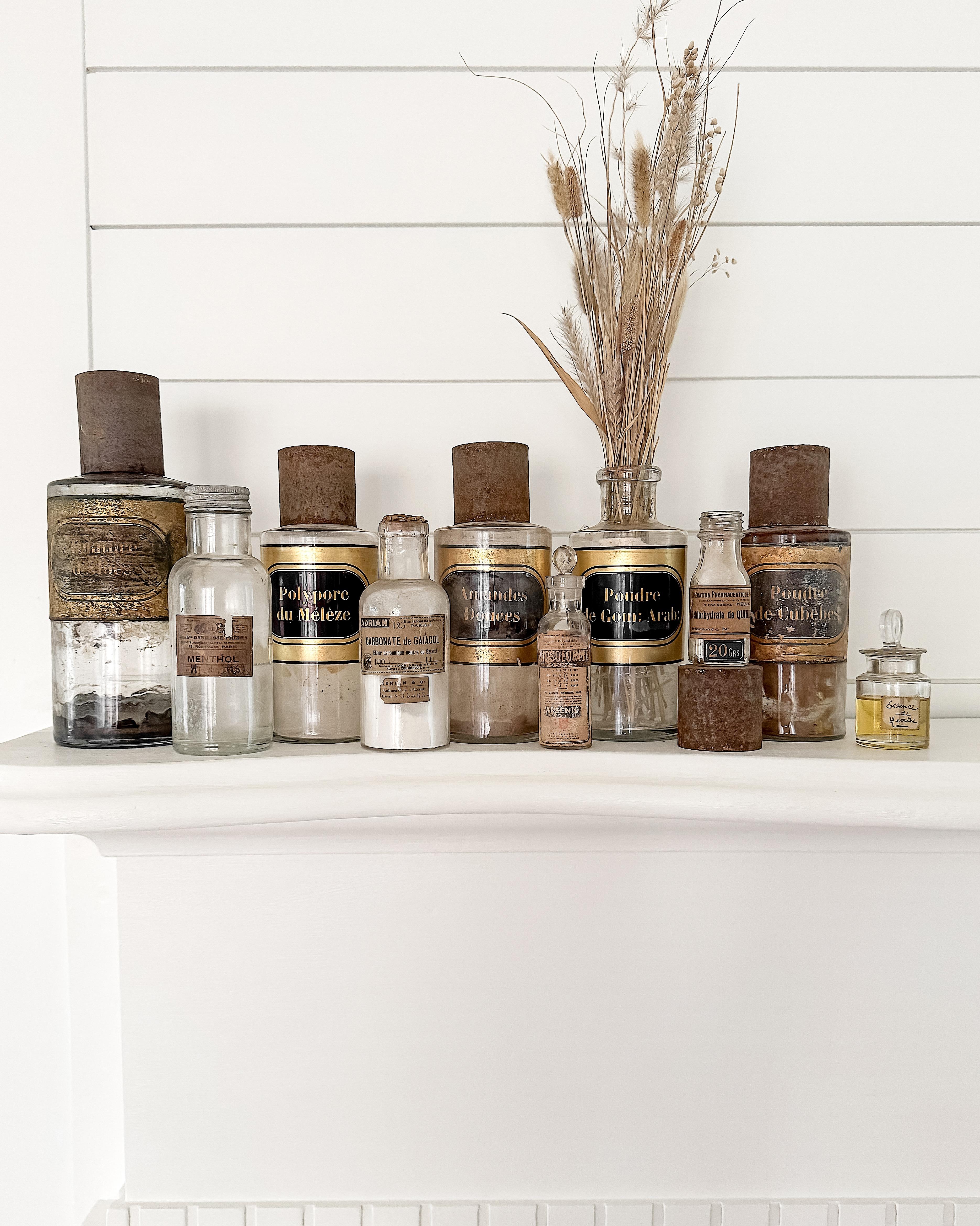 A fascinating collection of ten antique French apothecary bottles, dating from the late 19th to early 20th centuries. Each piece tells its own story, with a beautifully aged mix of glass, original paper, and etched labels, and a variety of cork,