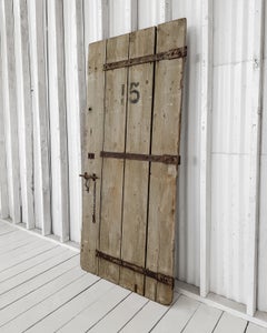 Early 20th Century Reclaimed 4-Board French Barn Door with Iron Strap Hardware