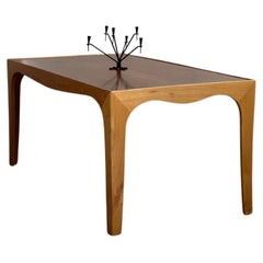 Elegant 1940s coffee table by Danish modern cabinet maker in elm and hardwood.