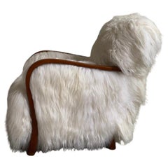 1940s Danish Lounge chair reupholstered in long haired Icelandic sheepskin.