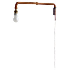 Rara applique francese di metà secolo in corda patinata, ottone e rame.