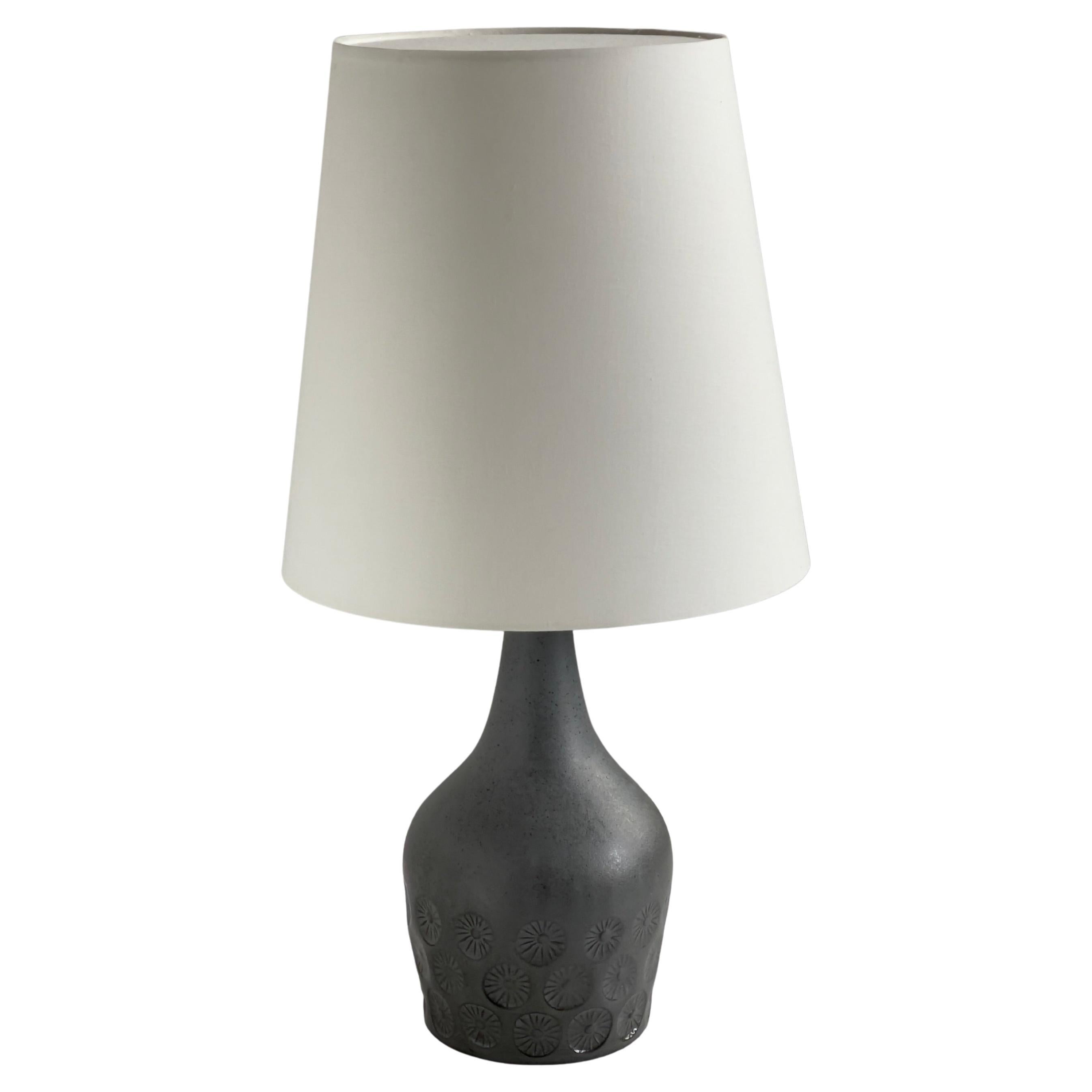 1950s Danish stoneware table lamp in ocean blue glazed tones and flower motifs.