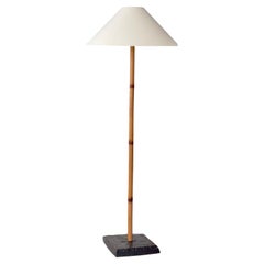 Rare Finnish 1960s floor lamp in patinated bamboo rattan and stained oak base.