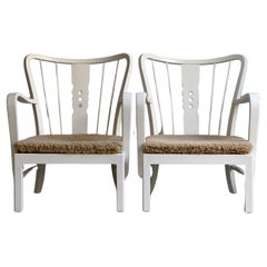 Fritz Hansen 1930s Pair of danish easy chairs in matte white paint and sheepskin