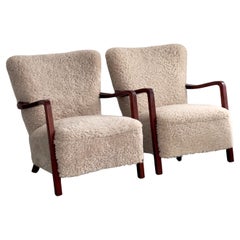 Pair of 1930 danish Svend Aage Madsen arm chairs in stained beech and shearling Pair of 1930 danish Svend Aage Madsen arm chairs in stained beech and shearling