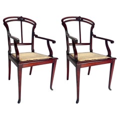 Pair of Art Nouveau wooden armchairs by Carlo Zen, Italy