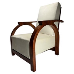 Sillón escultural de madera con respaldo arqueado de estilo Art Déco, Italia, década de 1930