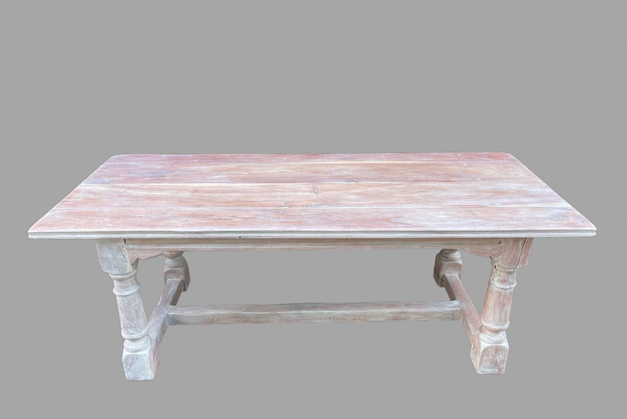 An attractive stripped and limed  Cherrywood refectory/farmhouse table with H stretcher, showing the lighter and darker parts of the Fruitwood Cherry.

Measures: Length 214 cm, Width 92 cm and Height 75 cm with Knee Height 65 cm.