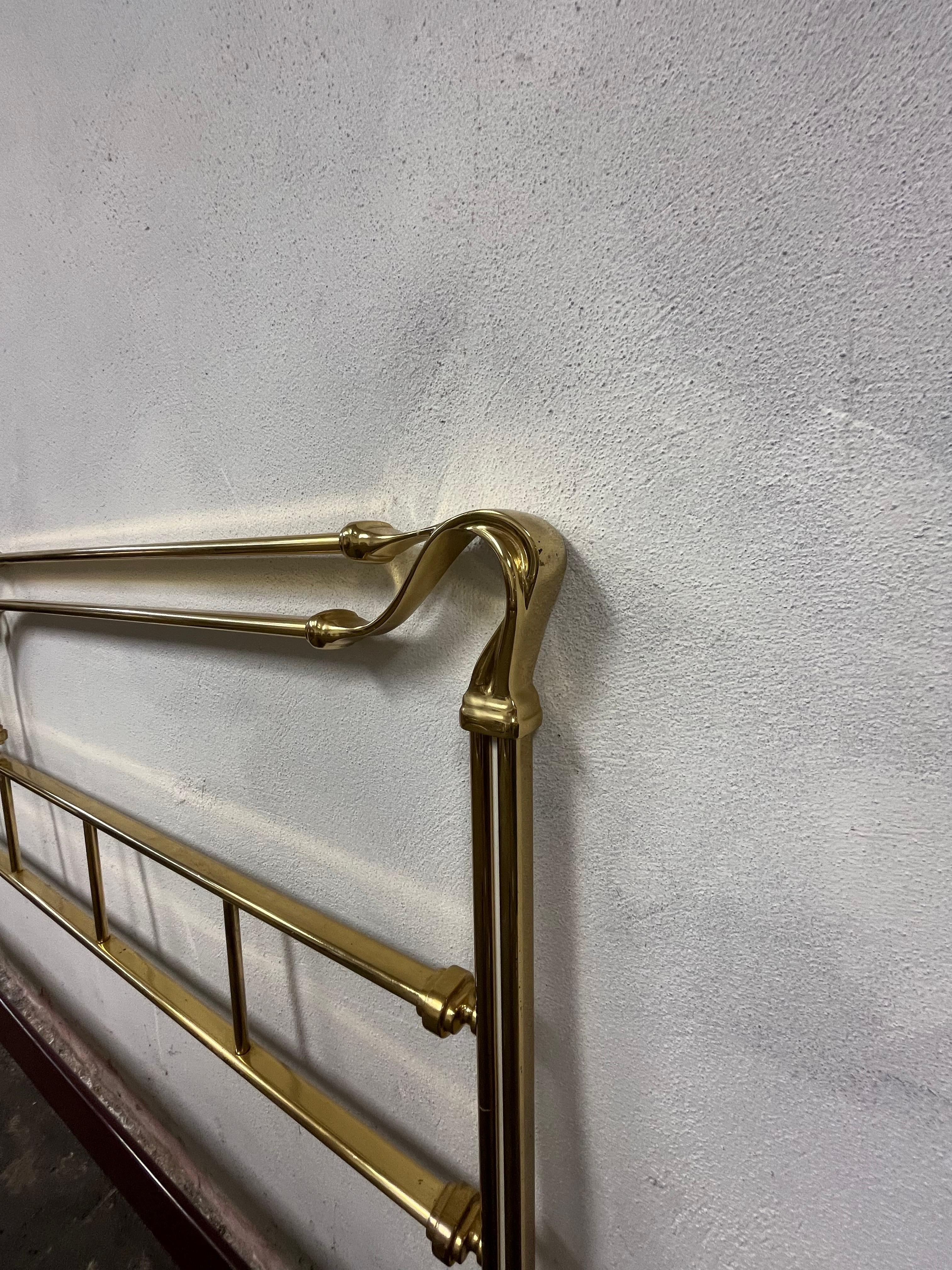 
Stunning Mid Century Bed Frame of Lacquered Brass, Italy, 1970s for Bloomingdales.
This glamorous bed frame consists of a decorative headboard and footboard with simple connecting steel side bars. The head and foot are solid lacquered brass with