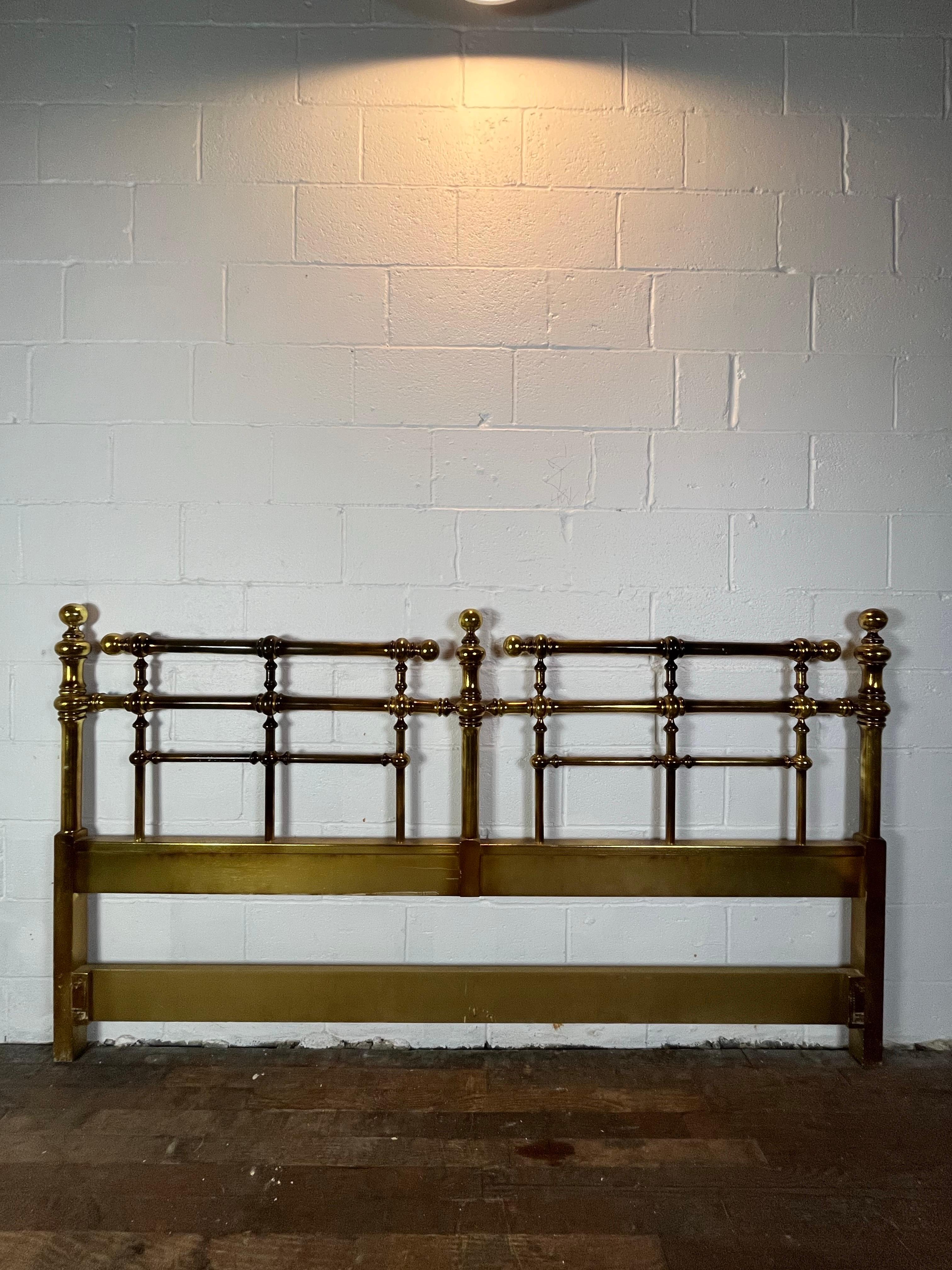 Classic Drexel Campaign headboard from their Et Cetera collection. Gold gilt finish add sophistication and glamour. Campaign styling with sleek horizontal design accented with heavy ball finials. King Size