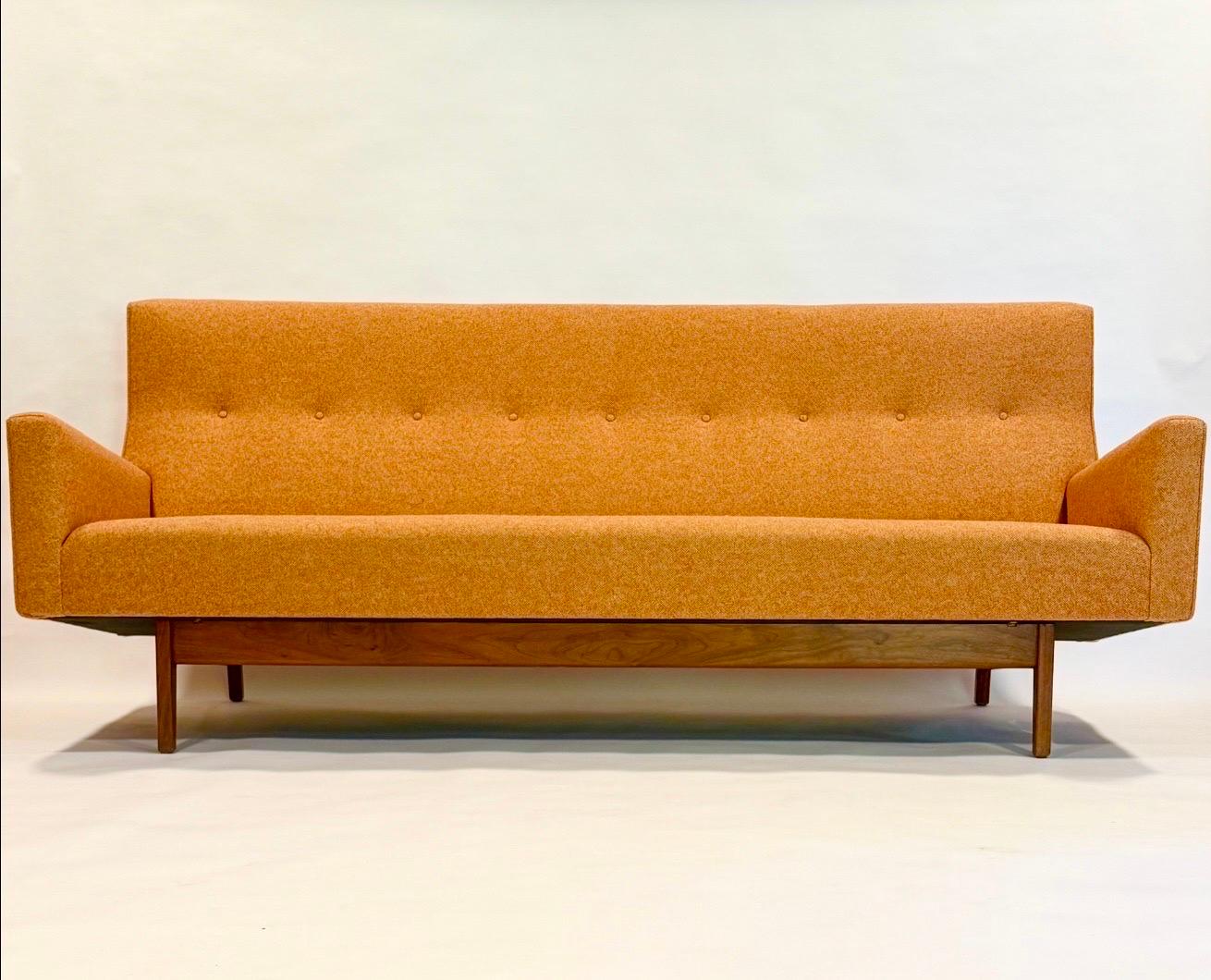 Incredible modern “floating sofa” designed by Jens Risom, Model # U-150 c1964. Our expert upholsterer took this all original tangerine colored hopsack fabric and reversed it. It revealed the original color bright and practically new. The wool has an