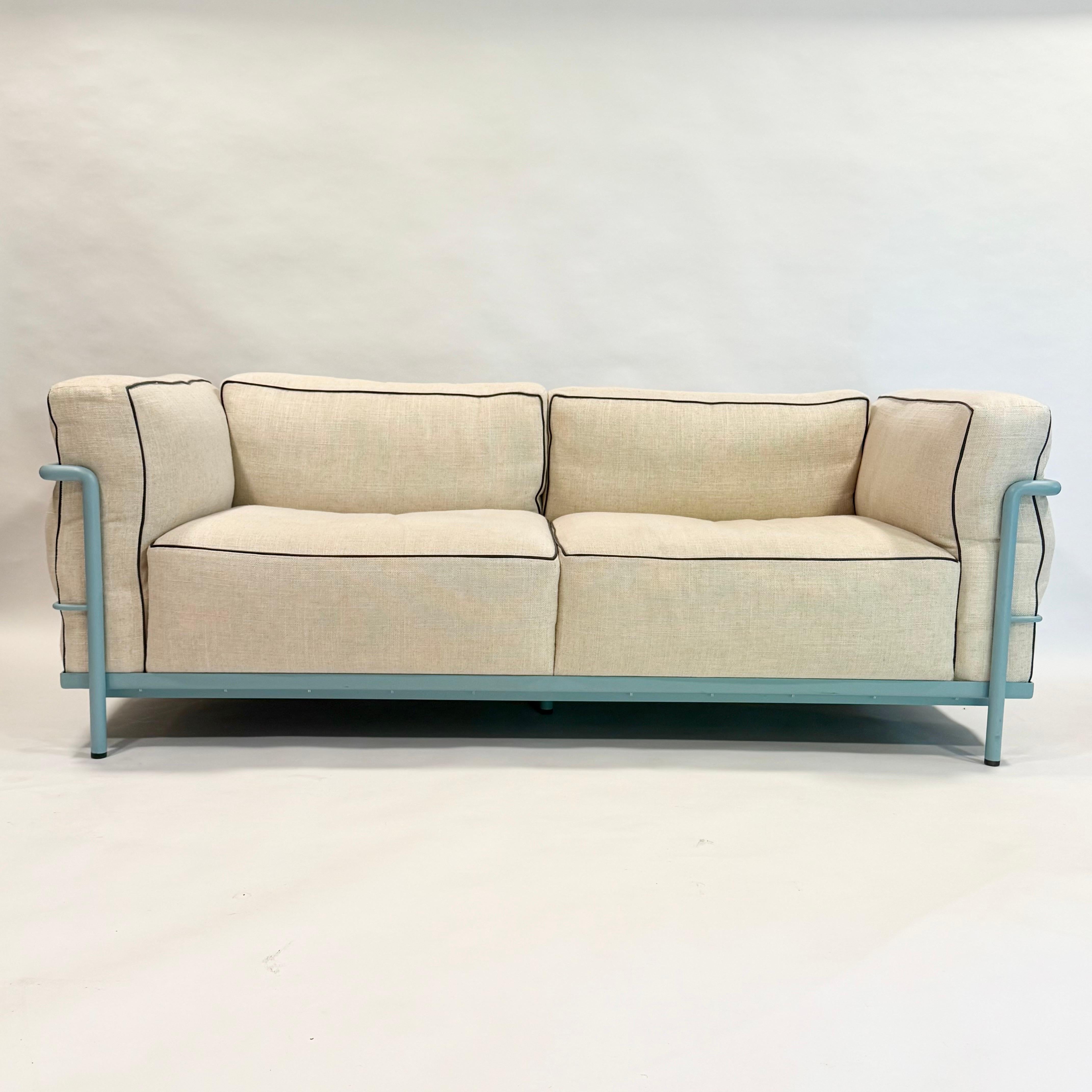 Super cute custom Corbusier LC2 Grand Model with light blue frame and cream colored down filled cushions with dark brown leather piping. This is a stunning sofa and a custom order. This piece was hardly used. All Cassina serial numbers are present.