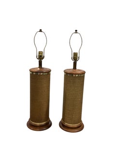 Pair of Vintage Cane Wrapped Lamps on Wood Bases with Brass Accents.
