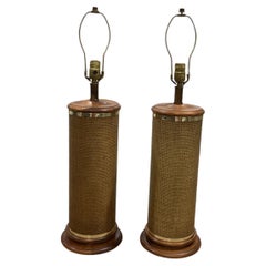 Pair of Vintage Cane Wrapped Lamps on Wood Bases with Brass Accents.